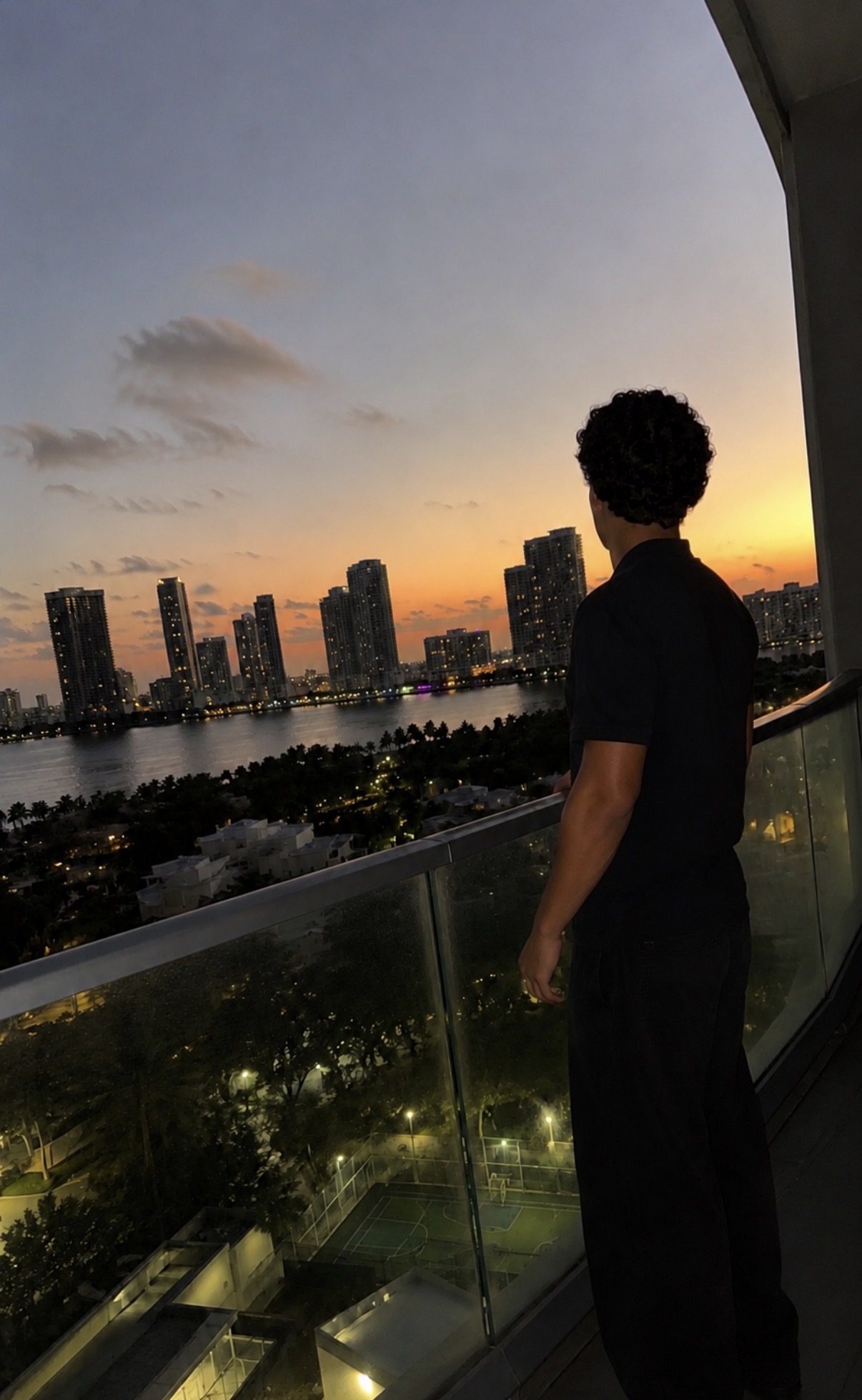 Andy looking at the Miami skyline at sunset